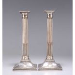A PAIR OF GEORGE III OLD SHEFFIELD PLATE COLUMNAR CANDLESTICKS