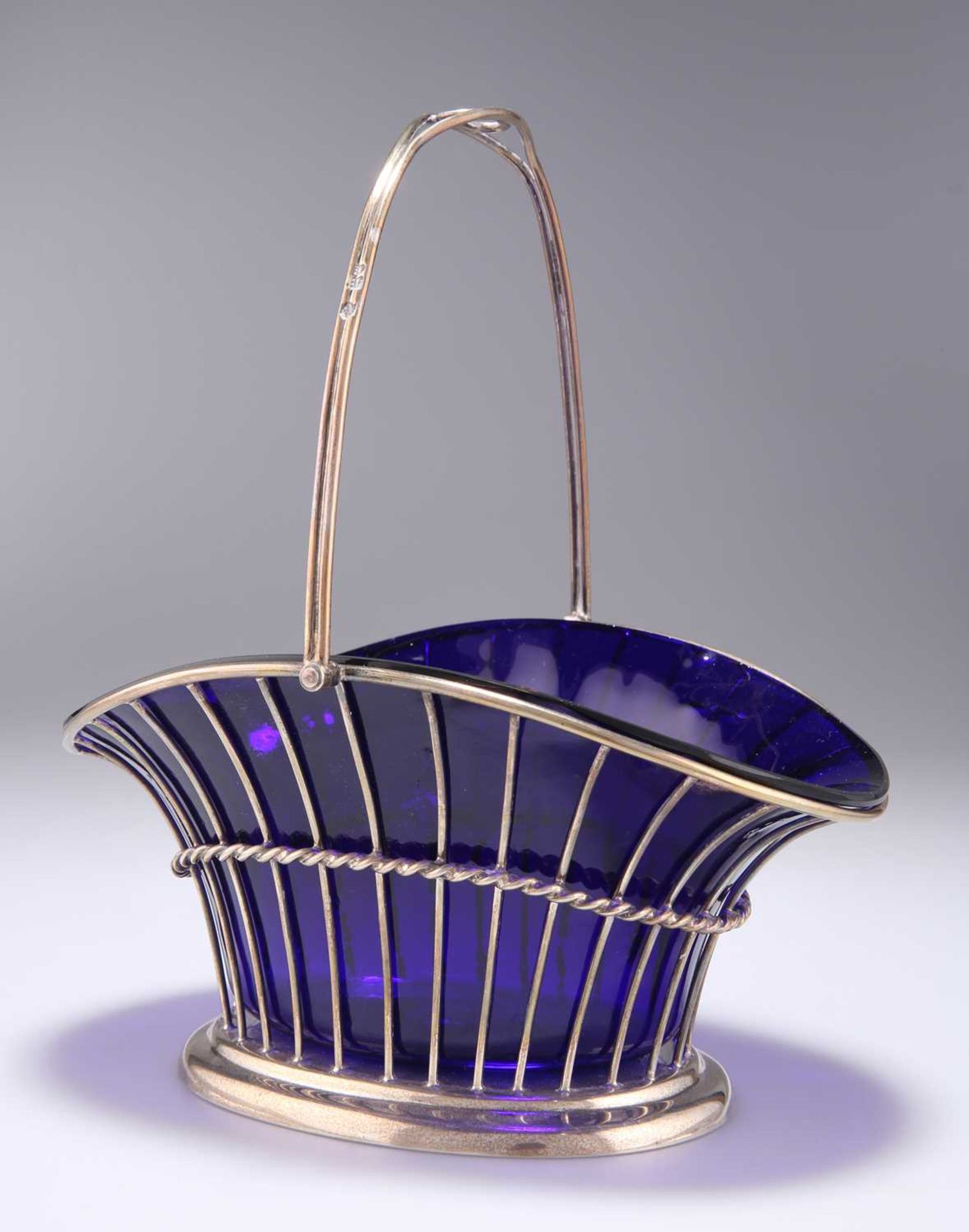 AN EDWARDIAN SILVER SWING-HANDLE BASKET