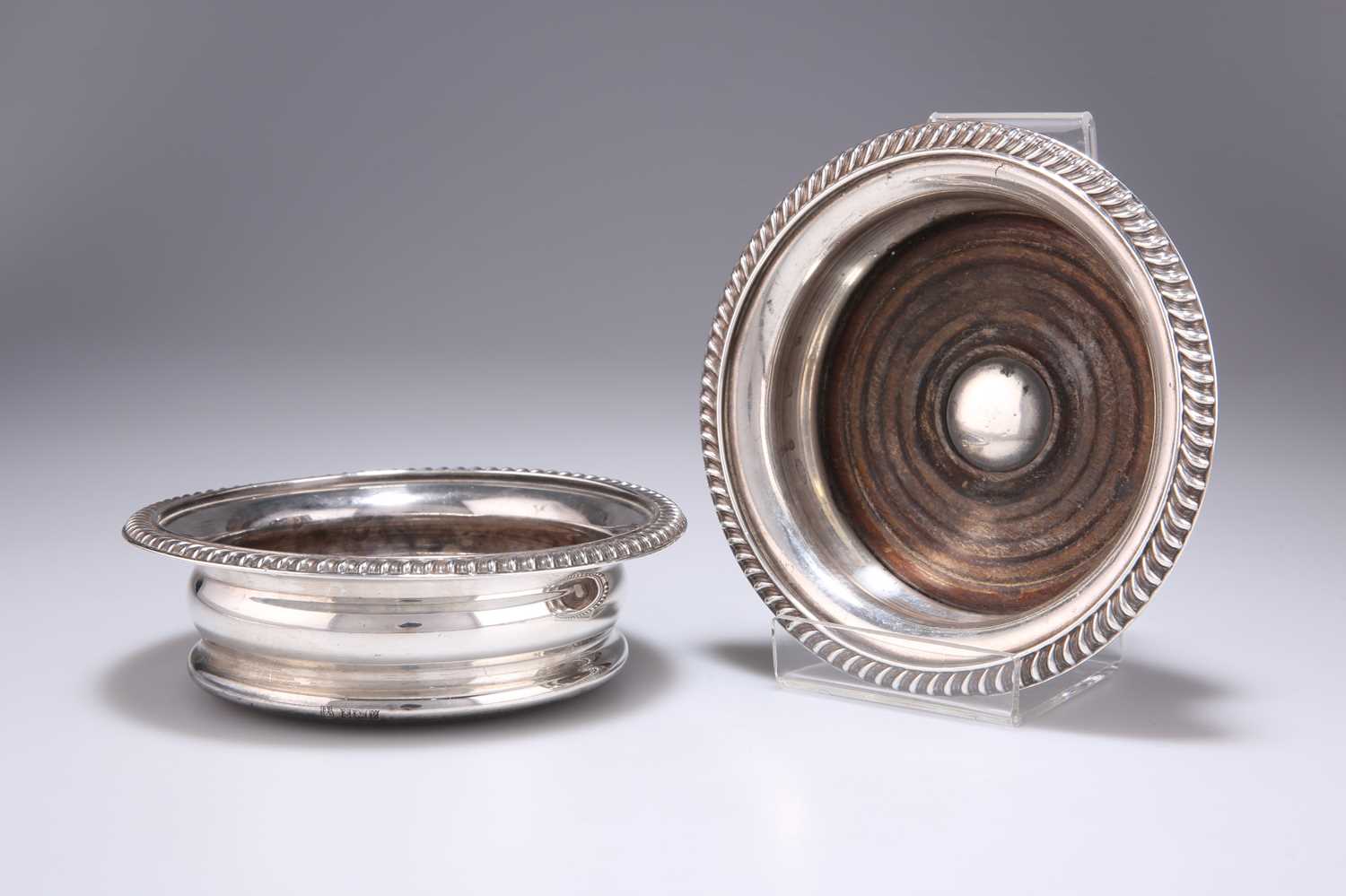 A PAIR OF GEORGIAN STYLE SILVER COASTERS