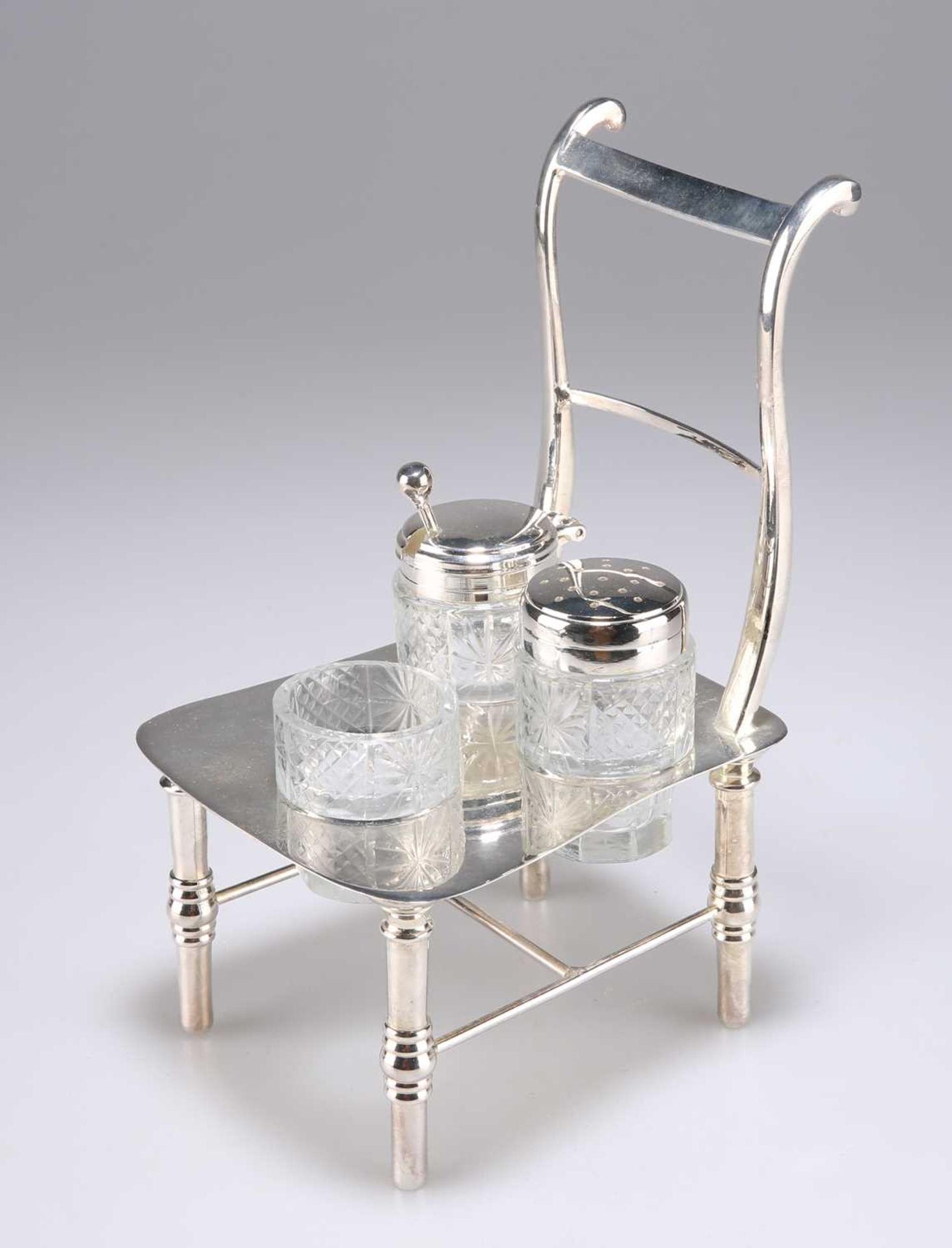 A SILVER-PLATED NOVELTY CRUET SET, CIRCA 1900