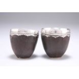 A PAIR OF LATE 18TH/EARLY 19TH CENTURY MOUNTED COCONUT CUPS