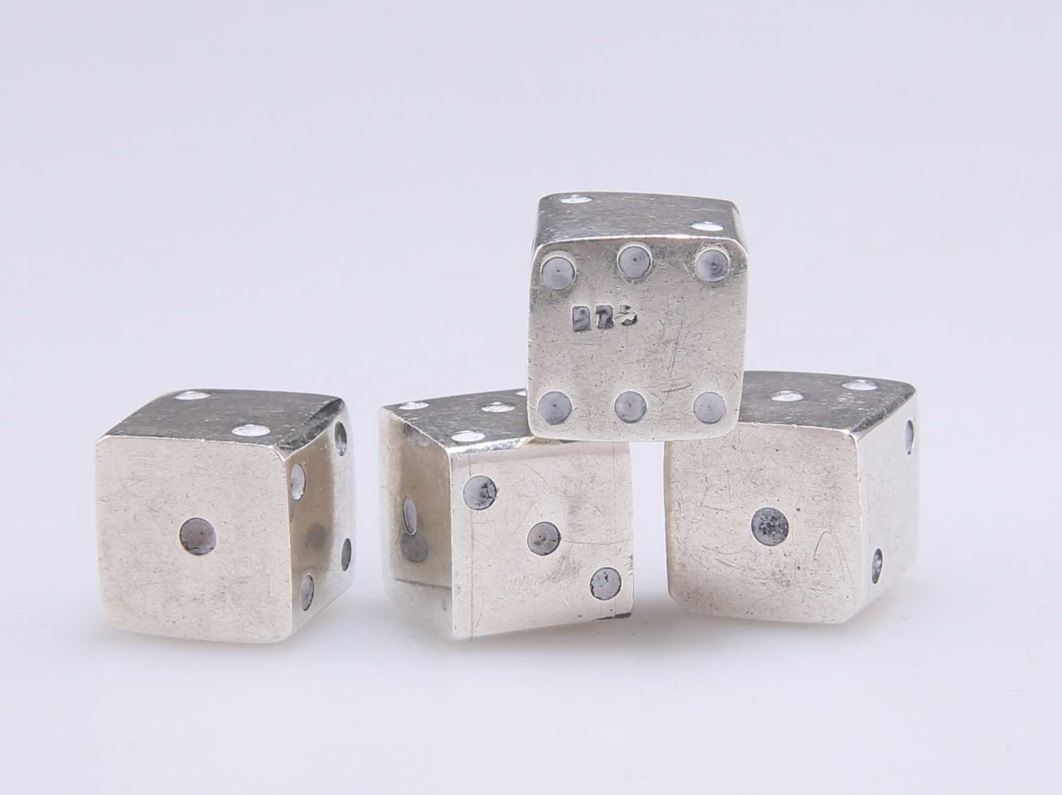 A SET OF FOUR DICE