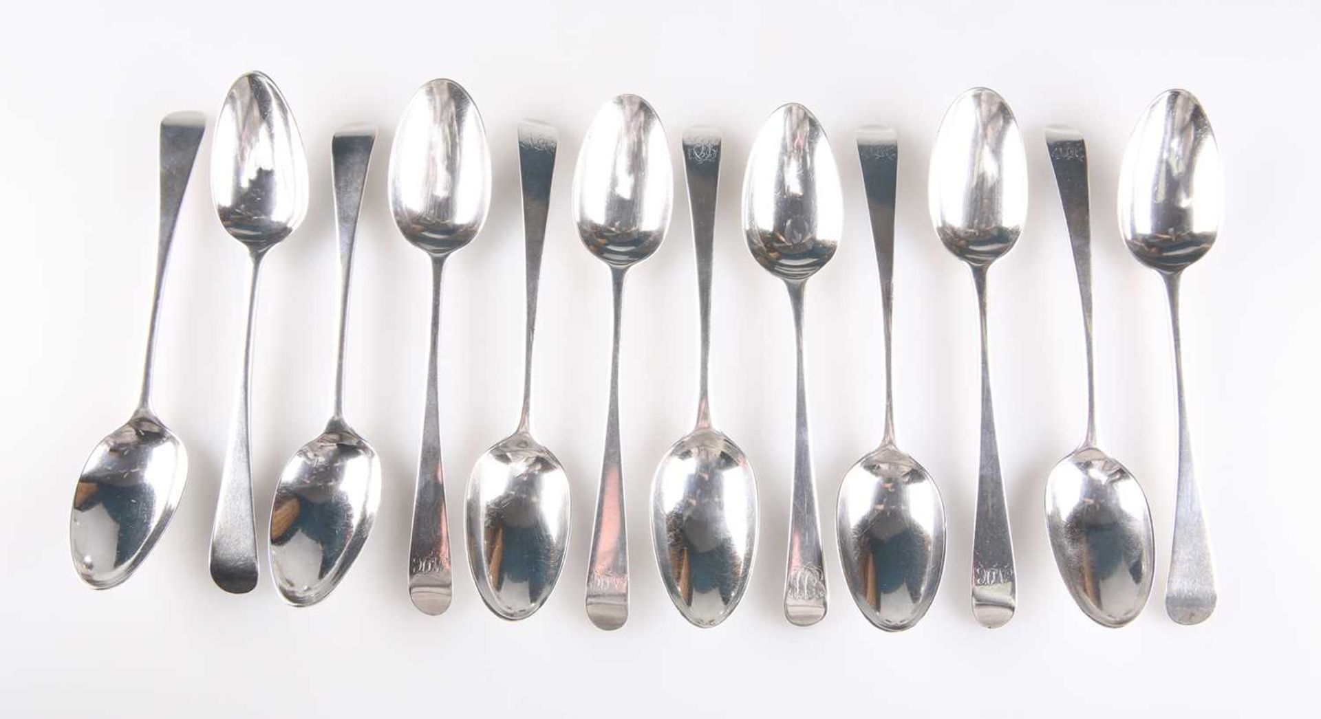 TWELVE GEORGE III OLD ENGLISH PATTERN SILVER DESSERT SPOONS