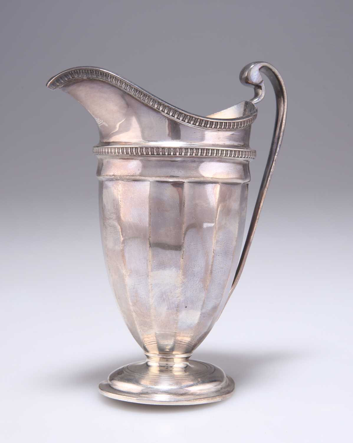 A GEORGE V SILVER CREAM JUG