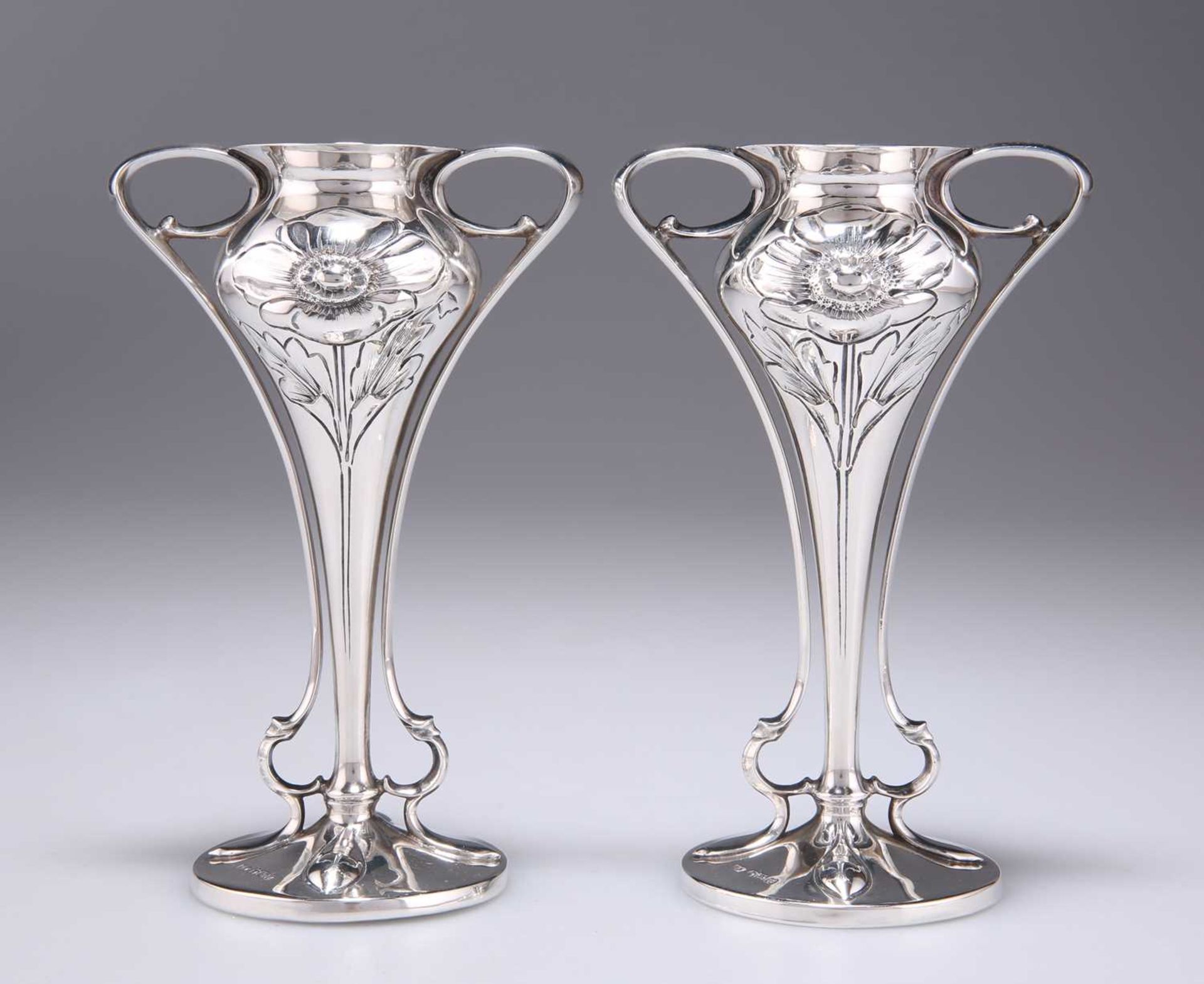 A PAIR OF ART NOUVEAU TWIN-HANDLED POSY VASES