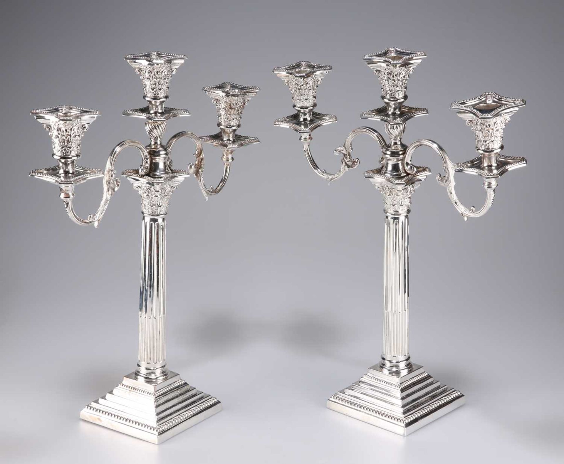 A PAIR OF VICTORIAN SILVER-PLATED CORINTHIAN COLUMN CANDELABRA - Image 2 of 3