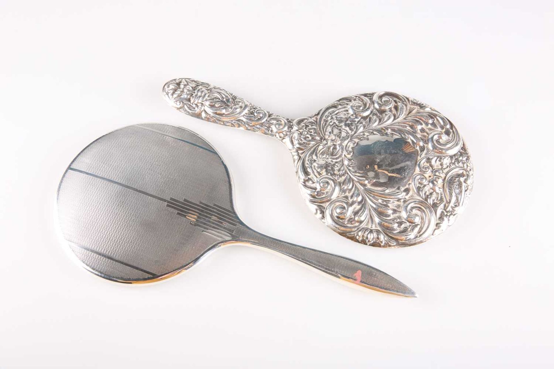 TWO ELIZABETH II SILVER-MOUNTED HAND-MIRRORS