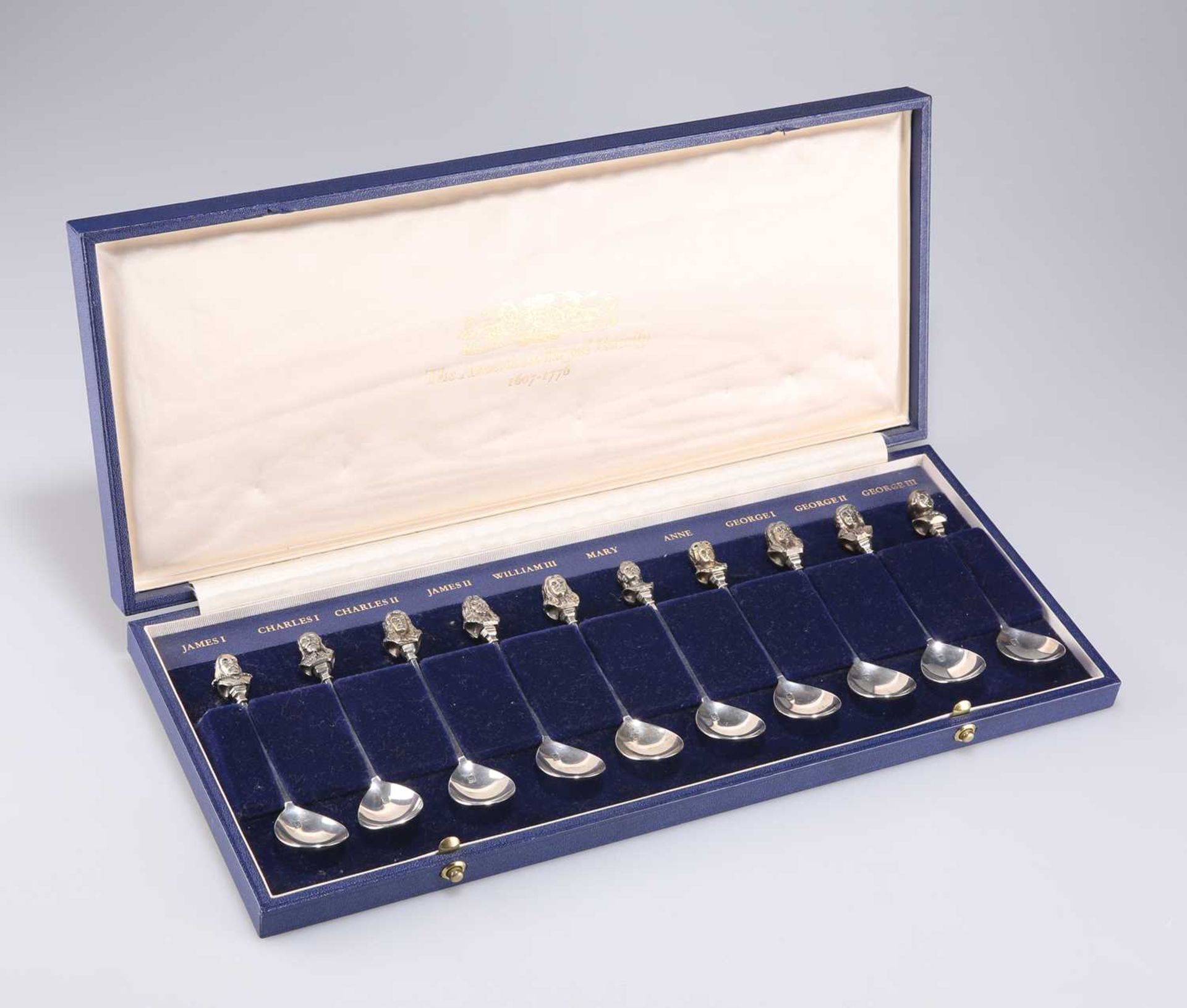 ROYAL INTEREST: A SET OF TEN ELIZABETH II SILVER AND PARCEL-GILT COMMEMORATIVE SPOONS