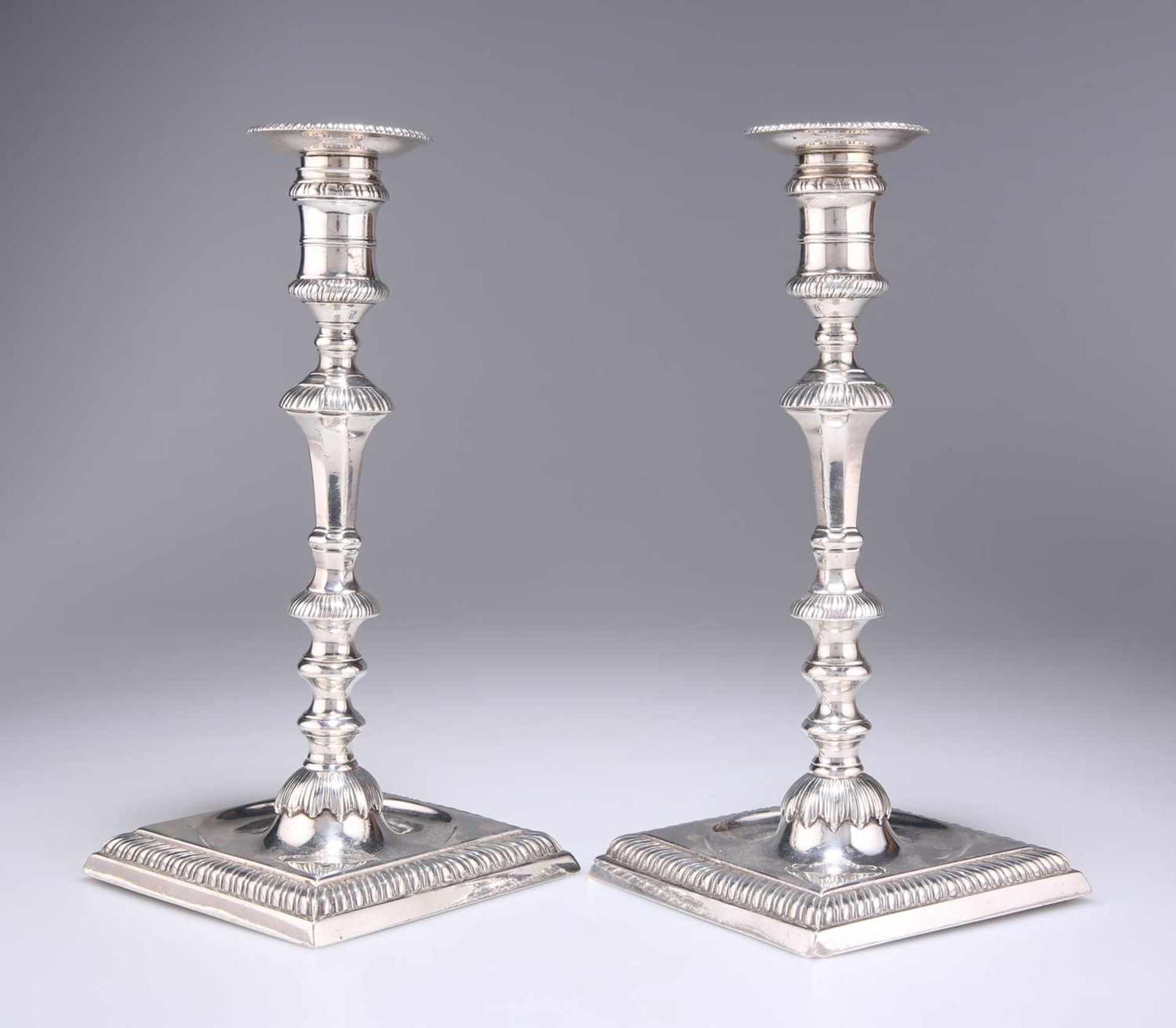 A PAIR OF GEORGE II SILVER CANDLESTICKS