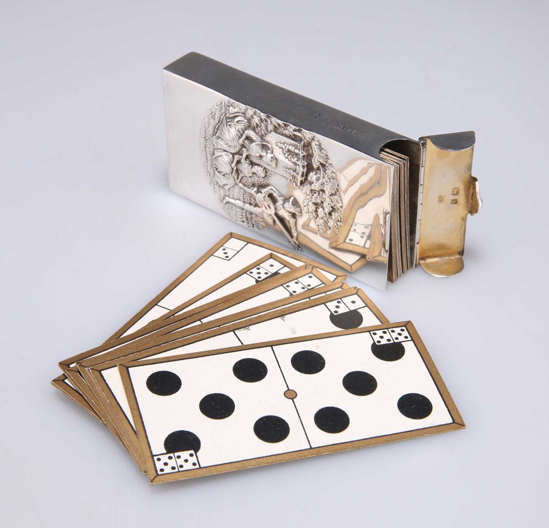 AN EDWARDIAN SILVER-CASED SET OF CARD DOMINOES