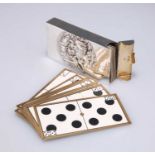 AN EDWARDIAN SILVER-CASED SET OF CARD DOMINOES