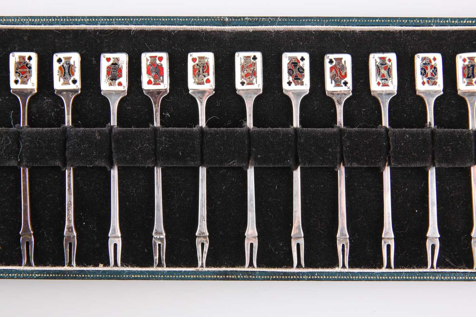 A SET OF TWELVE ELIZABETH II SILVER AND ENAMEL PICKLE FORKS