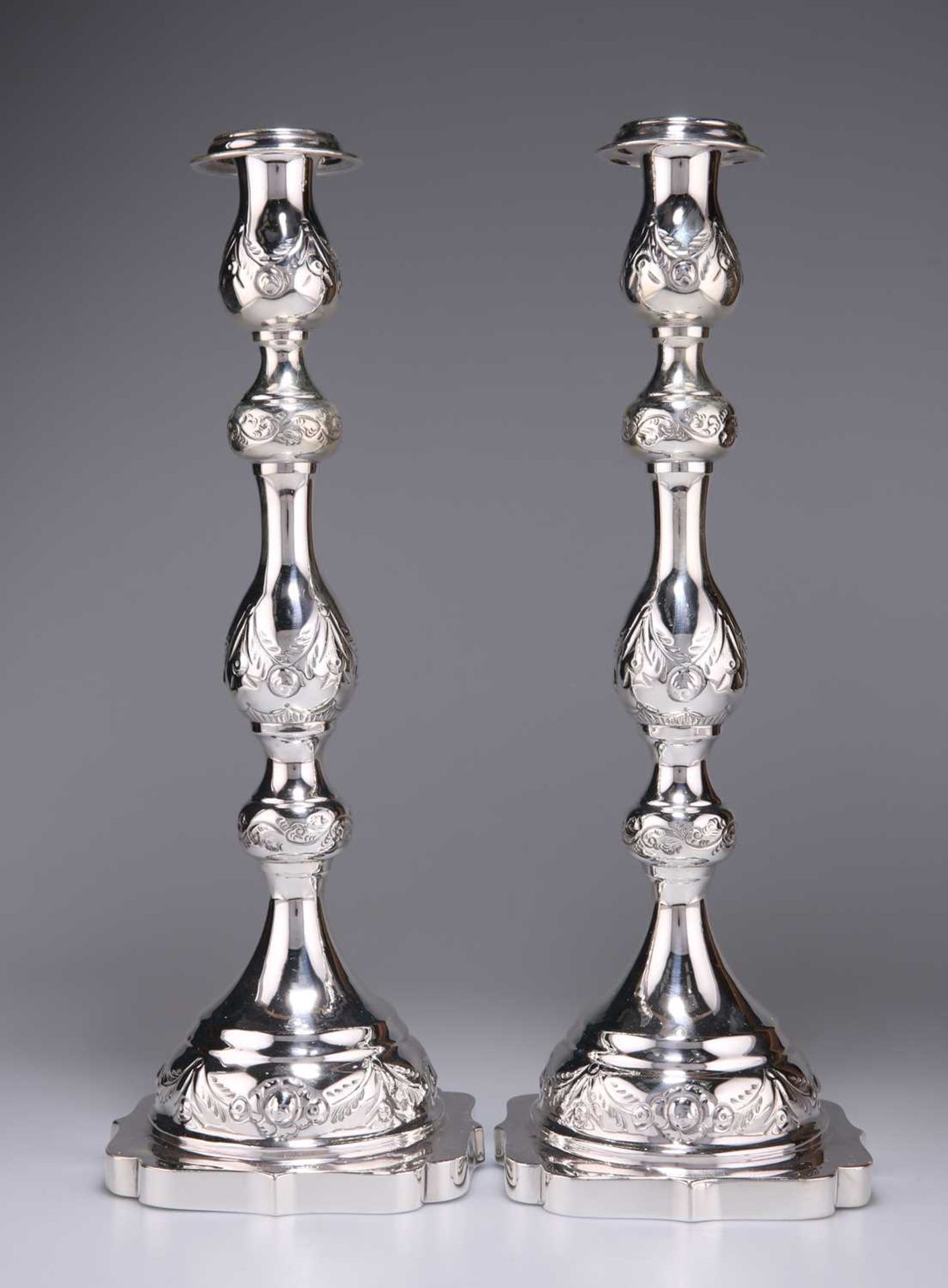 JUDAICA: A FINE PAIR OF GEORGE V SILVER SABBATH CANDLESTICKS