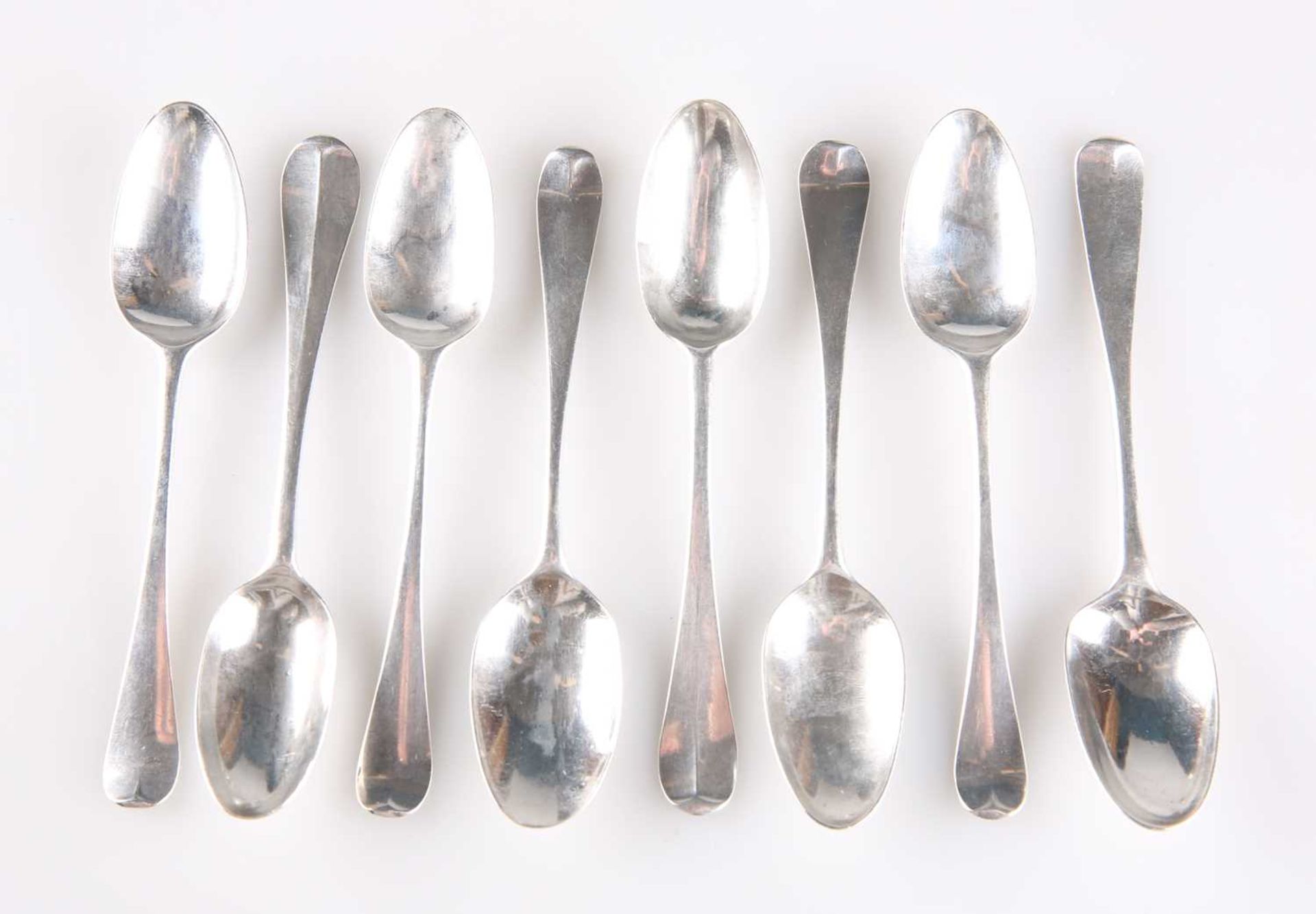 A SET OF EIGHT GEORGIAN SILVER TEASPOONS