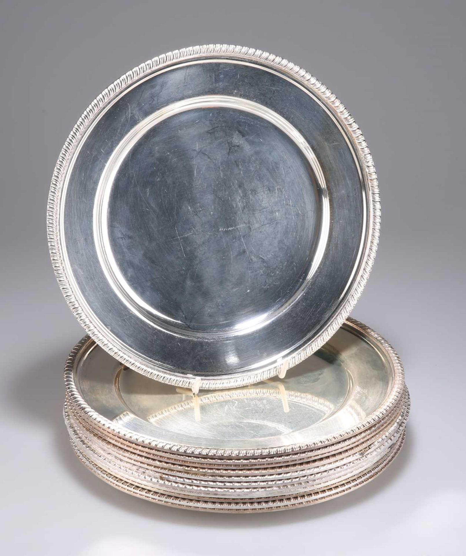 A SET OF TWELVE SILVER-PLATED DINNER PLATES, CIRCA 1900
