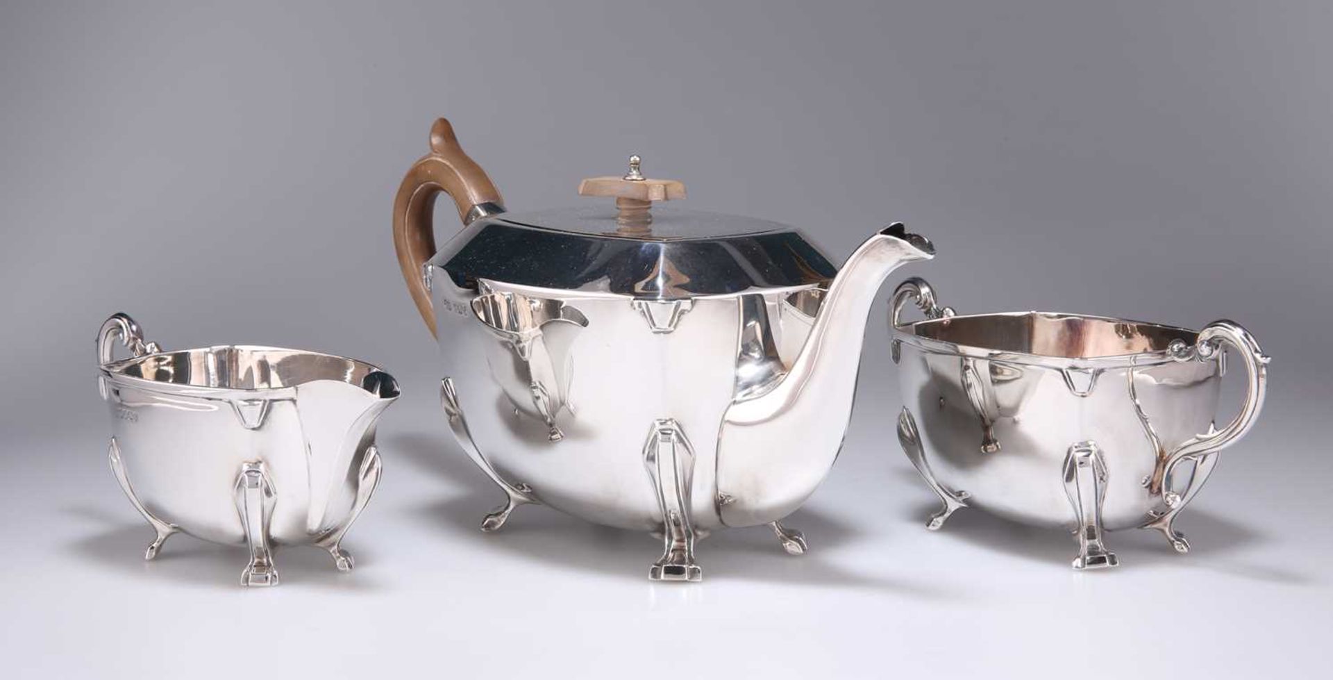 AN ART DECO SILVER THREE-PIECE TEA SERVICE