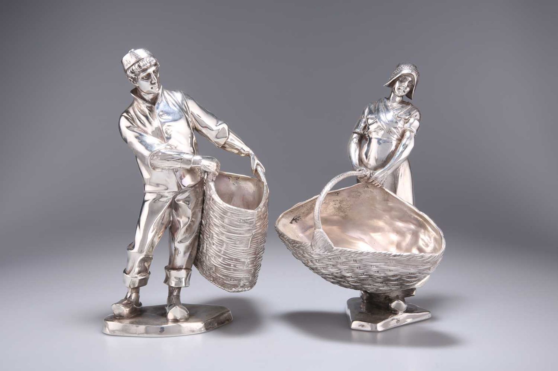 A PAIR OF GERMAN ELECTRO-PLATED FIGURAL TABLE BASKETS