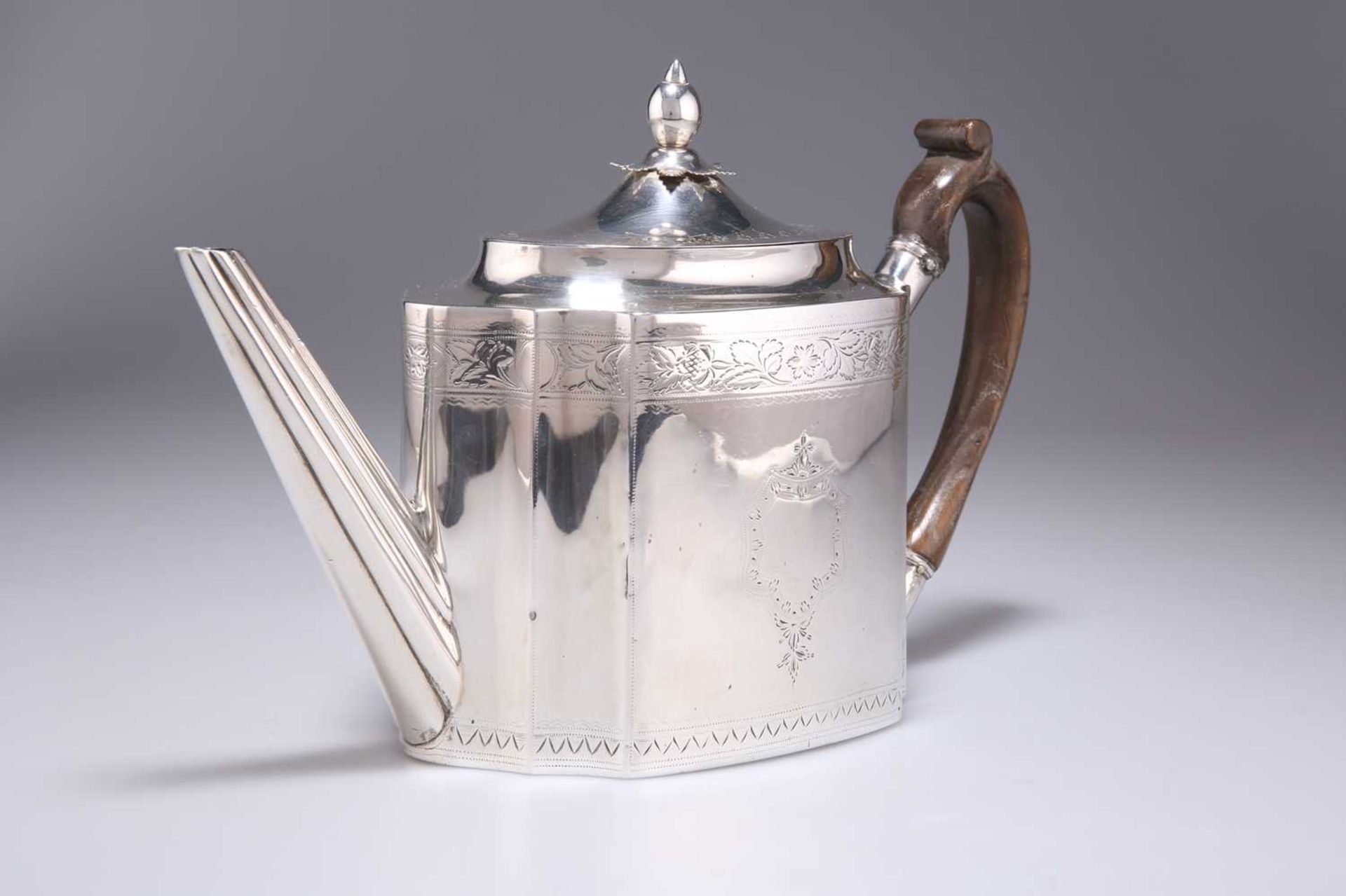 A GEORGE III IRISH SILVER TEAPOT