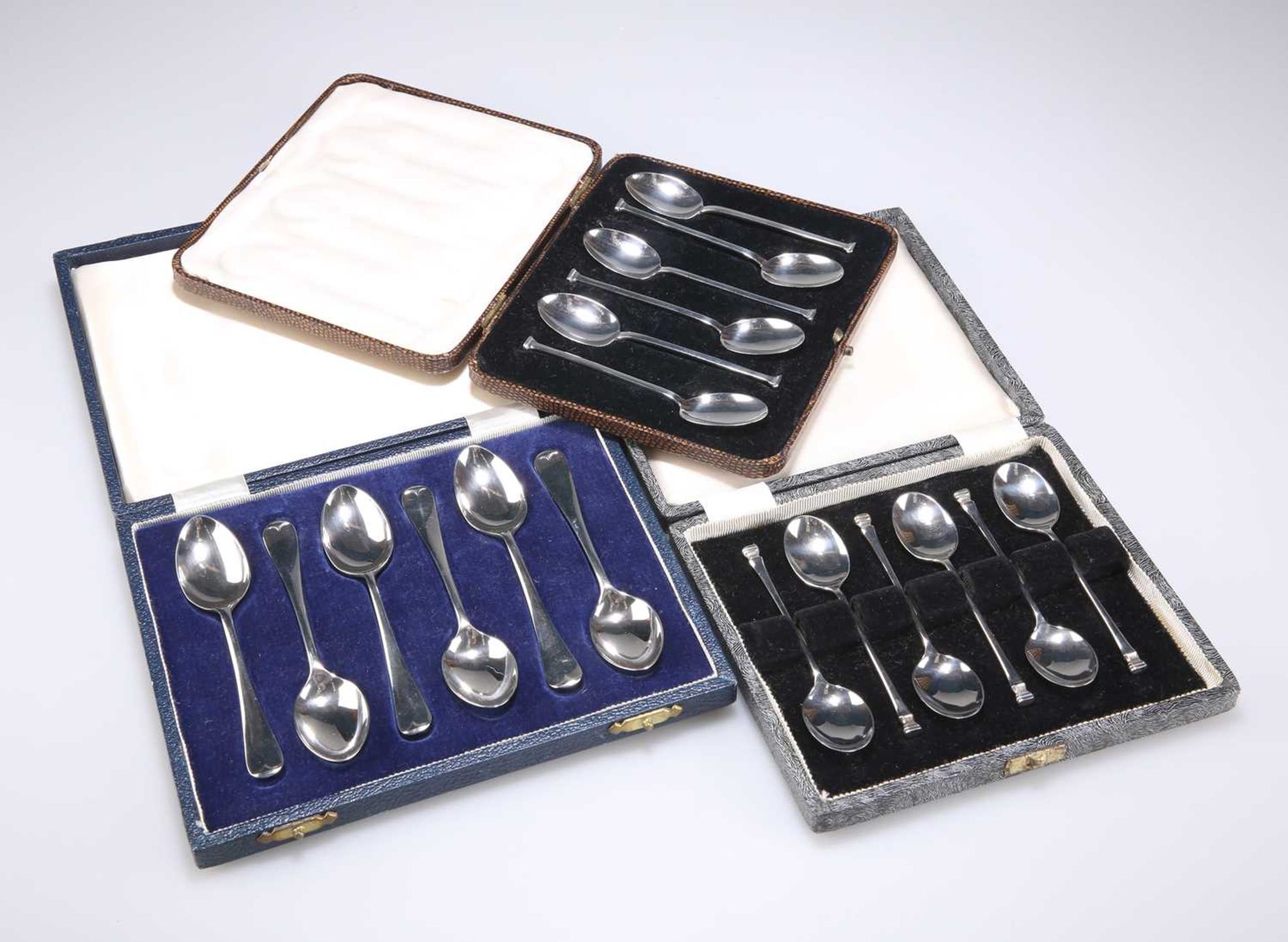 THREE CASED SETS OF SIX SILVER TEASPOONS, 20TH CENTURY