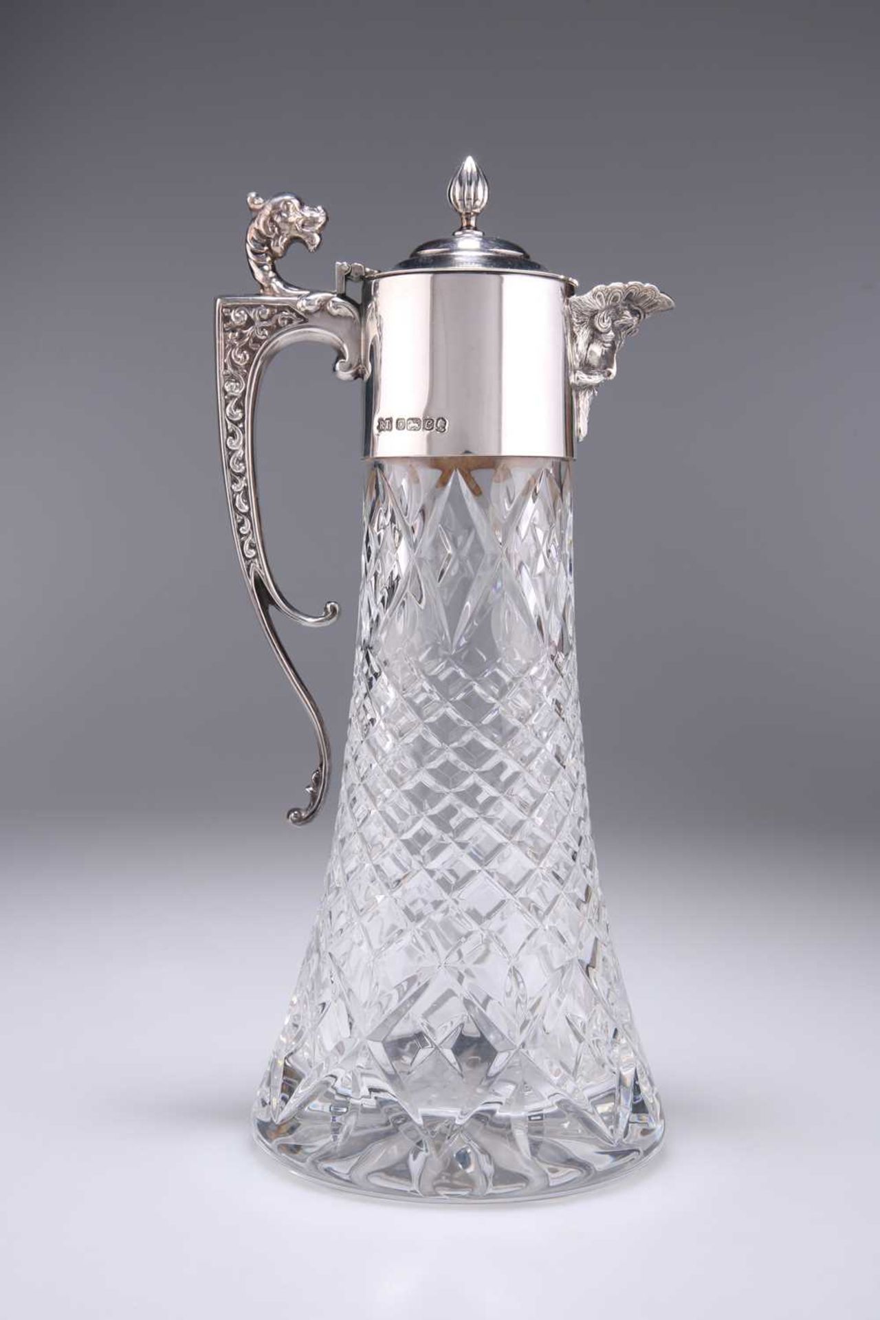 AN ELIZABETH II SILVER-MOUNTED GLASS CLARET JUG