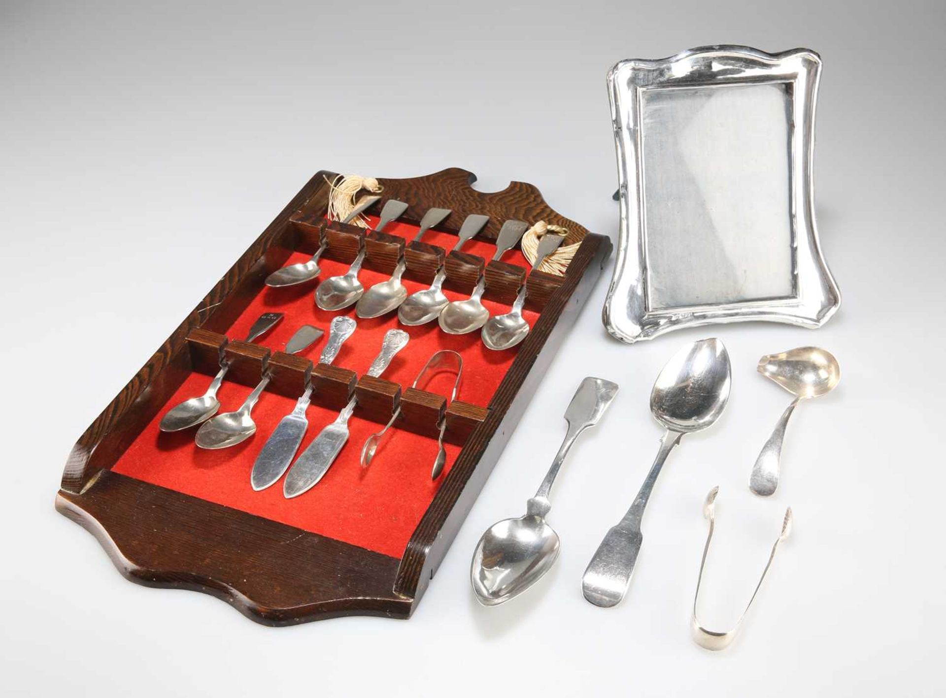 AN EDWARDIAN SILVER PHOTOGRAPH FRAME AND ASSORTED SILVER FLATWARE, GEORGIAN AND LATER