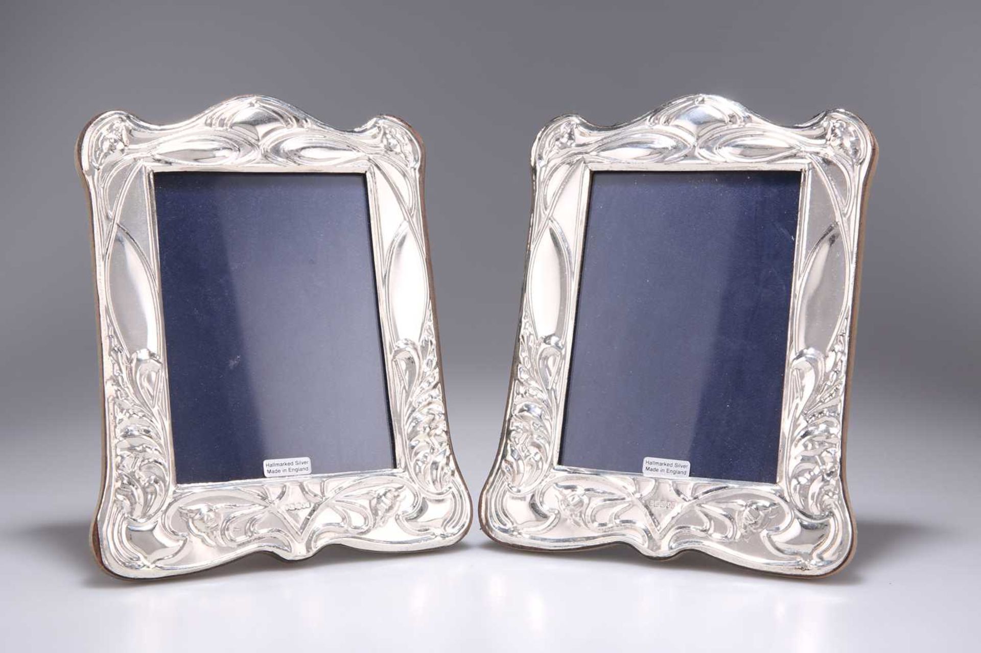 A PAIR OF ART NOUVEAU STYLE SILVER PHOTOGRAPH FRAMES