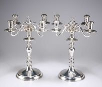 A PAIR OF GEORGE V SILVER CANDELABRA IN 17TH CENTURY STYLE
