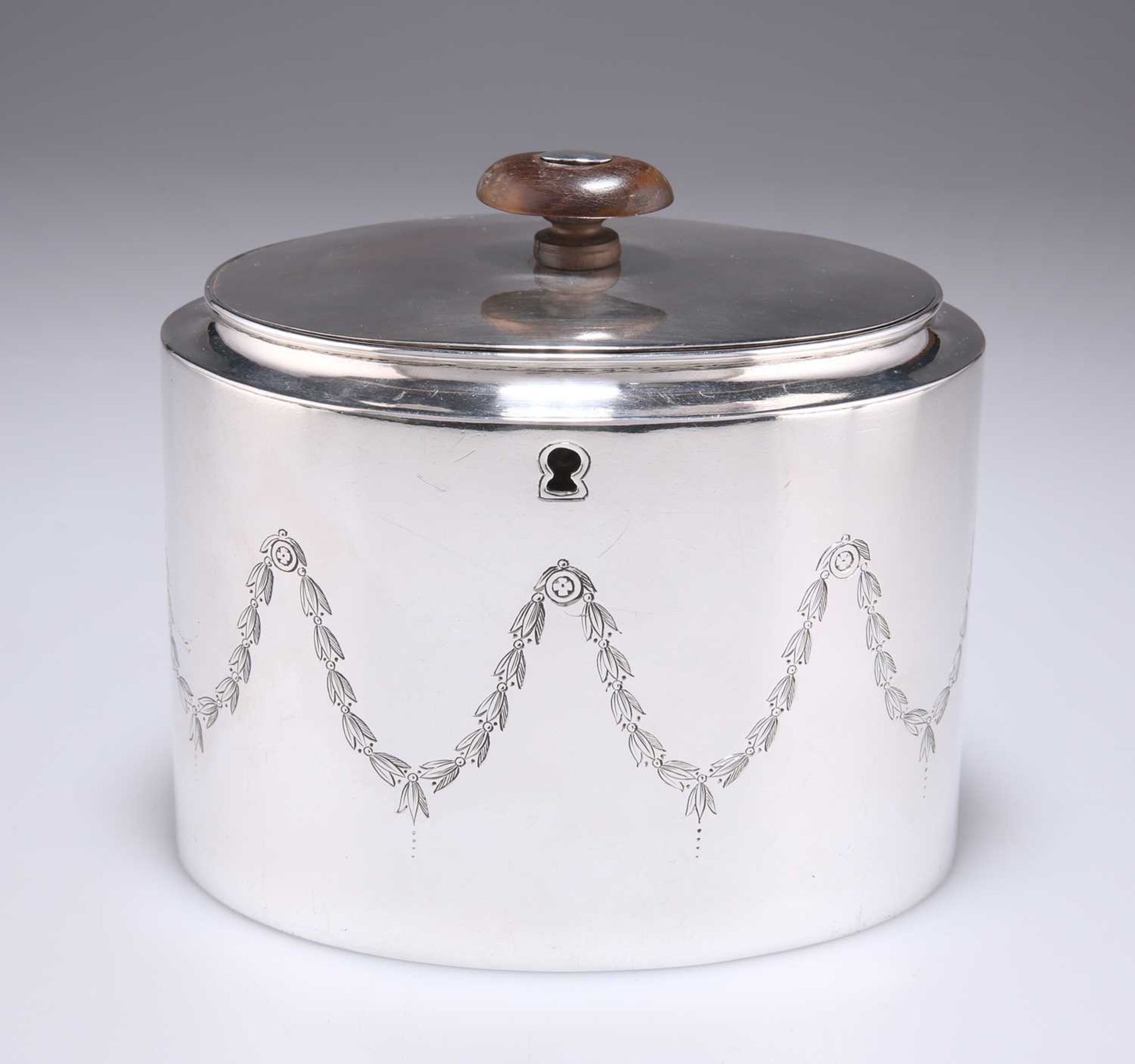 A GEORGE III SILVER TEA CADDY