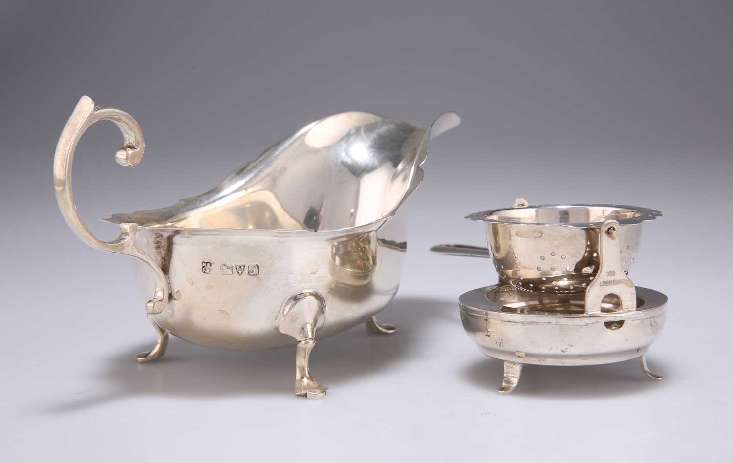 A GEORGE V SILVER SAUCE BOAT, AND A FOREIGN SILVER TEA STRAINER - Image 2 of 2