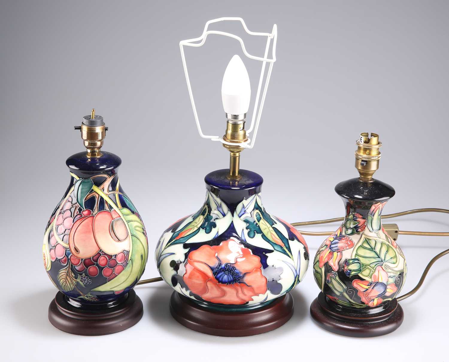 THREE MODERN MOORCROFT POTTERY TABLE LAMPS