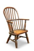 A 19TH CENTURY OAK AND BEECH PRIMITIVE WINDSOR CHILD'S CHAIR