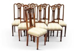 A SET OF EIGHT ARTS AND CRAFTS STYLE INLAID MAHOGANY DINING CHAIRS