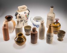 A GROUP OF STONEWARE AND CERAMIC BOTTLES