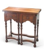AN EARLY 18TH CENTURY OAK FOLDOVER WRITING TABLE