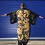 A VINTAGE BLACK SILK KIMONO