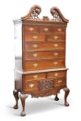 A HARDWOOD HIGH CHEST, IN AMERICAN COLONIAL STYLE