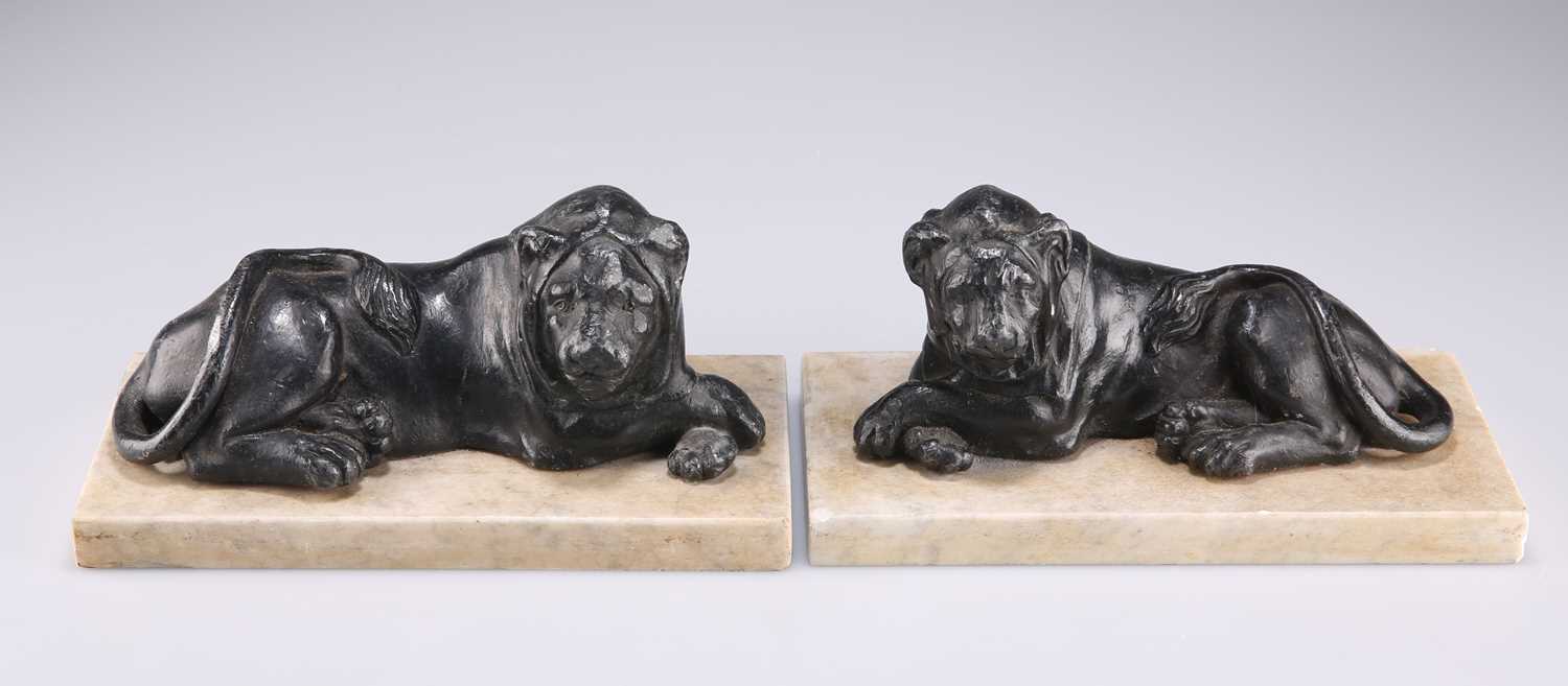 A PAIR OF 19TH CENTURY LEAD MODELS OF LIONS