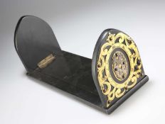 A VICTORIAN BRASS-MOUNTED AND EBONISED BOOK SLIDE