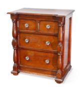 A VICTORIAN STAINED PINE MINIATURE CHEST OF DRAWERS