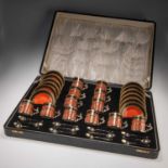 A CASED SET OF TWELVE ROYAL WORCESTER SILVER-GILT MOUNTED COFFEE CANS AND SAUCERS