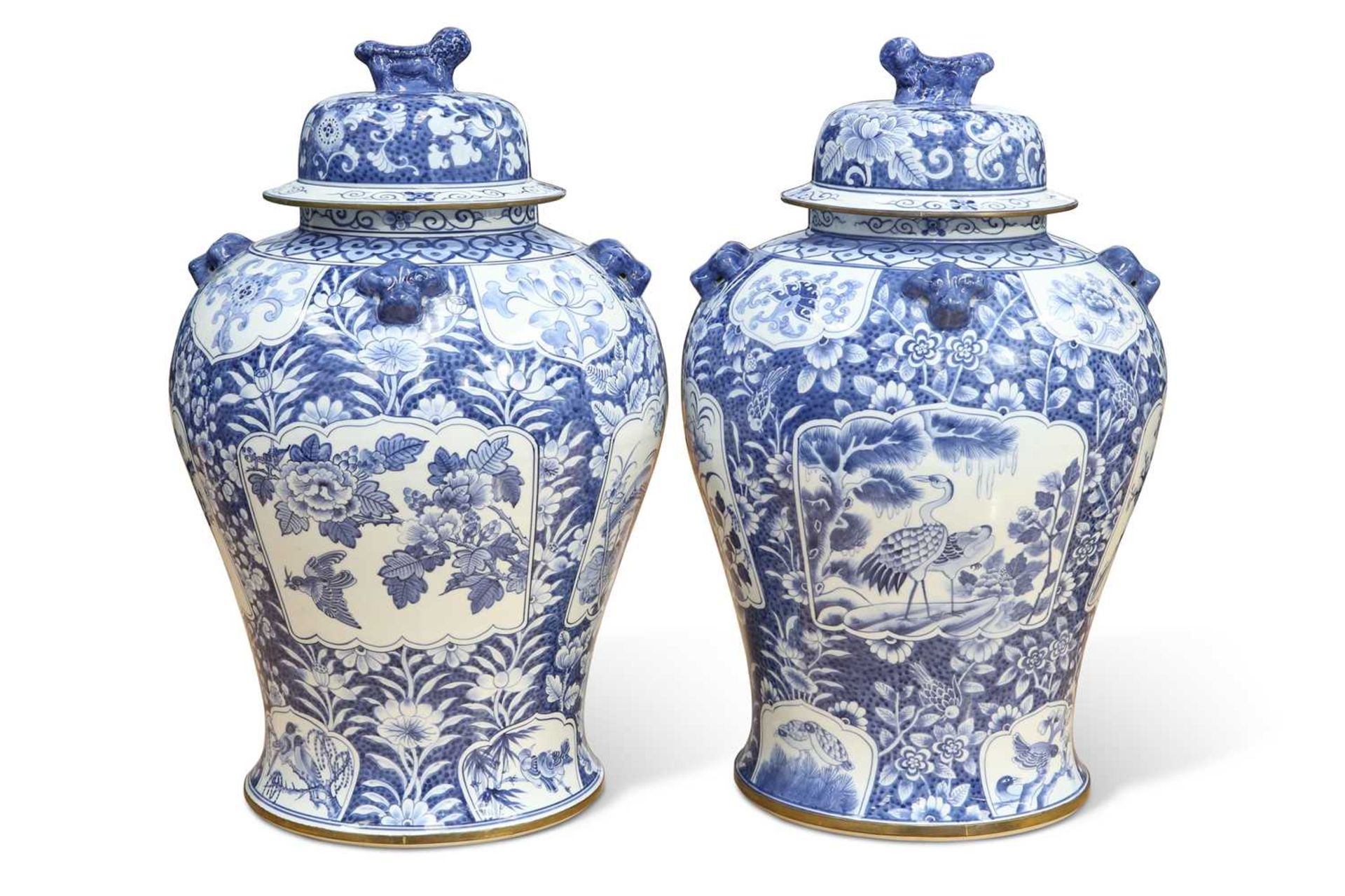 A LARGE PAIR OF BLUE AND WHITE PORCELAIN VASES AND COVERS