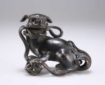A CHINESE SMALL BRONZE BUDDHIST LION, MING DYNASTY