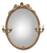 A LARGE 19TH CENTURY GILT-COMPOSITION OVAL MIRROR