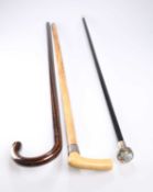 A CONTINENTAL SILVER-TOPPED EBONISED WALKING CANE