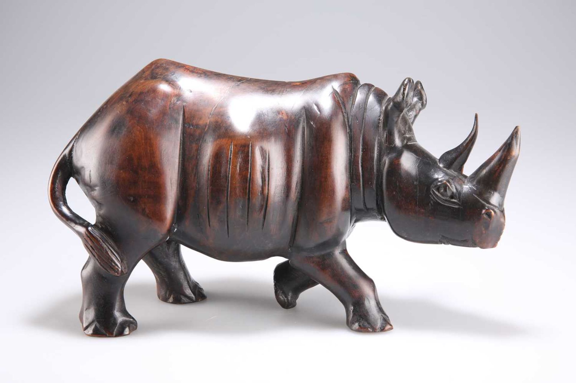 AN EARLY 20TH CENTURY HARDWOOD MODEL OF A RHINOCEROS - Image 2 of 2