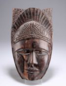 A CARVED TRIBAL MASK