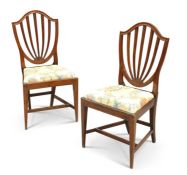 A PAIR OF GEORGE III 'HEPPLEWHITE' MAHOGANY SIDE CHAIRS, CIRCA 1780