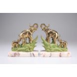 A PAIR OF ART DECO BRASS AND PAINTED 'ELEPHANT' BOOKENDS