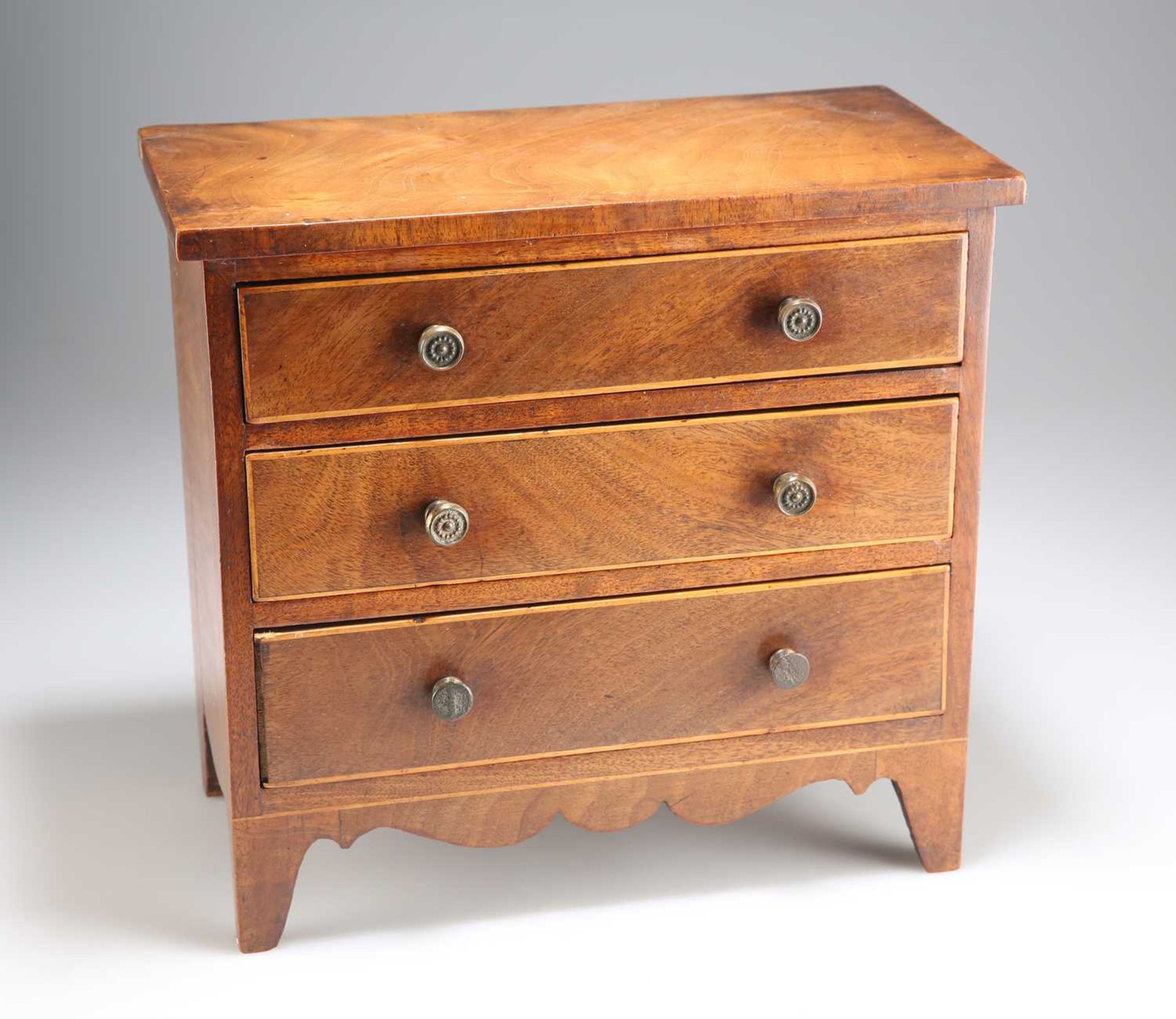 AN EARLY 19TH CENTURY MAHOGANY MINIATURE CHEST OF DRAWERS