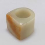 A CHINESE JADE THUMB RING